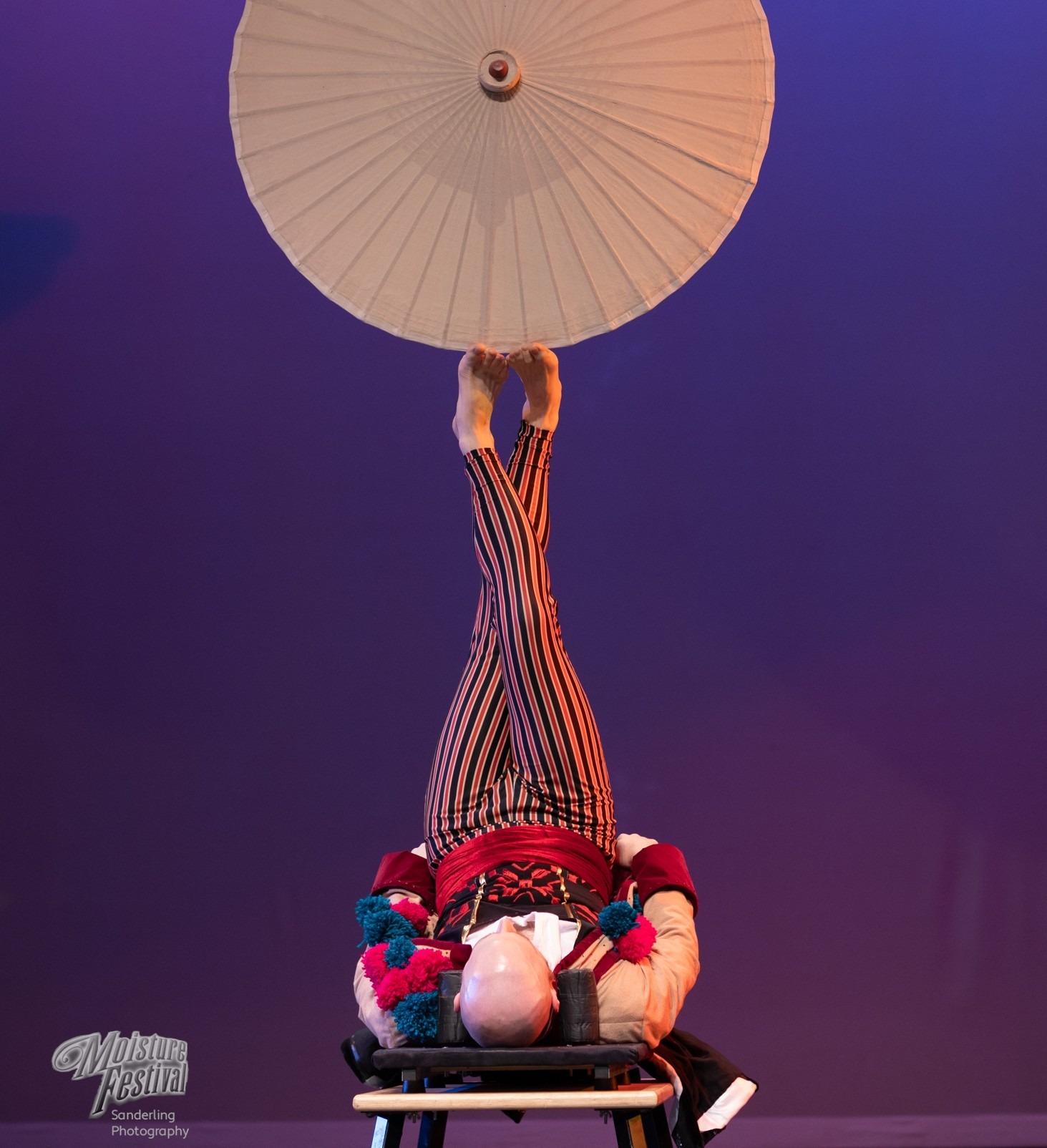 a person balancing an umbrella